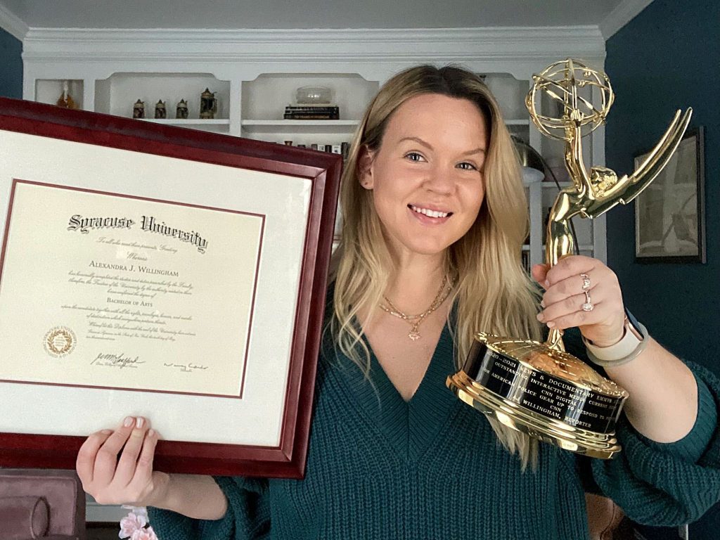 AJ Willingham holding Syracuse University diploma and Emmy Award