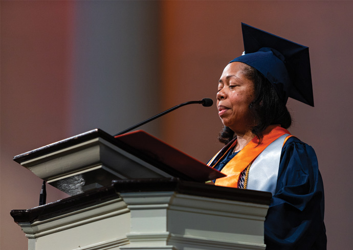 College of Professional Studies alumni and student convocation speaker Victoria Baratta delivers remarks at the podium